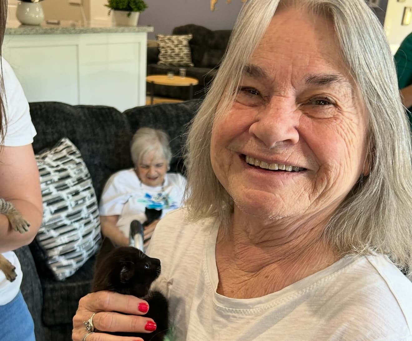 A caregiver helping a resident at Joy Senior Living in Loganville